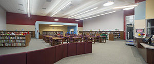 A student learning center features a mix of traditional book-based learning and digital computer-based learning.Photo Credit (All): LAN