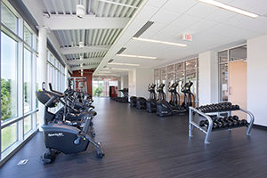 Students have access to three levels with locker rooms situated on the first floor, a gymnasium on the second, and fitness areas and wellness sites throughout. Photo Credit (all): Shelly Harrison